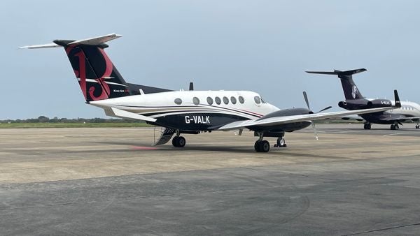 A Beechcraft King Air 200 parked on the runway.