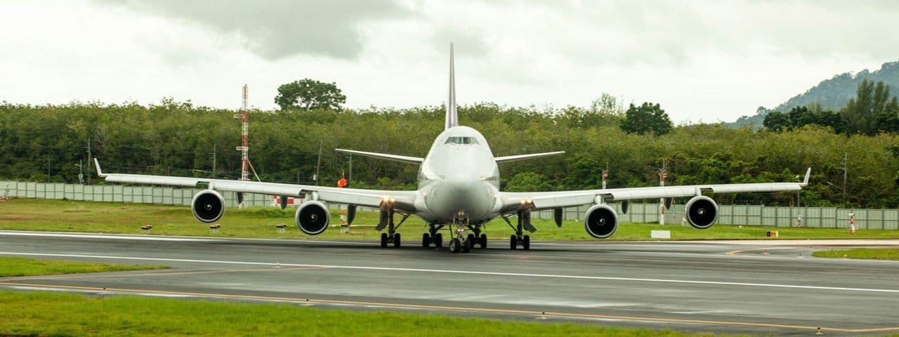 A Boeing 747-400 taxiing on a runway.