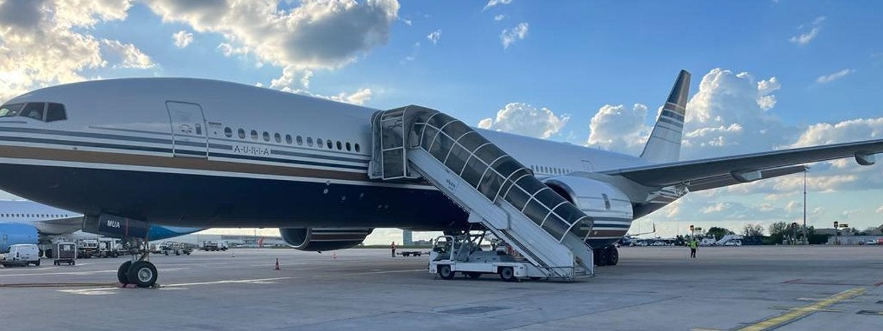 A Boeing 777 parked at an airport.