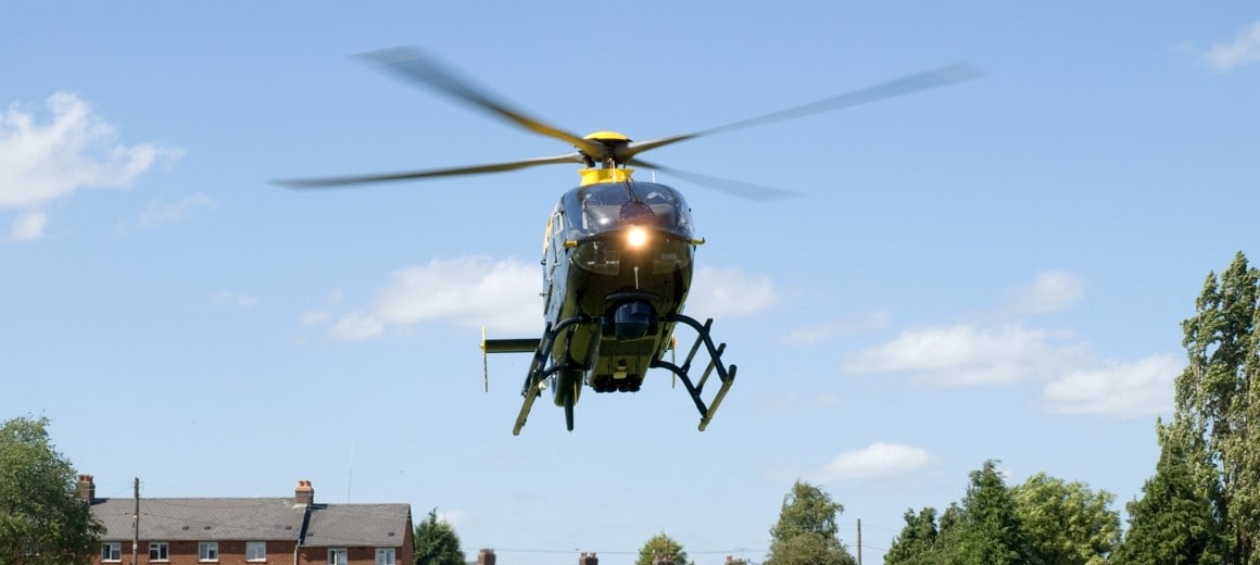 A Eurocopter EC135, now Airbus Helicopters H135, landing in a residential area.