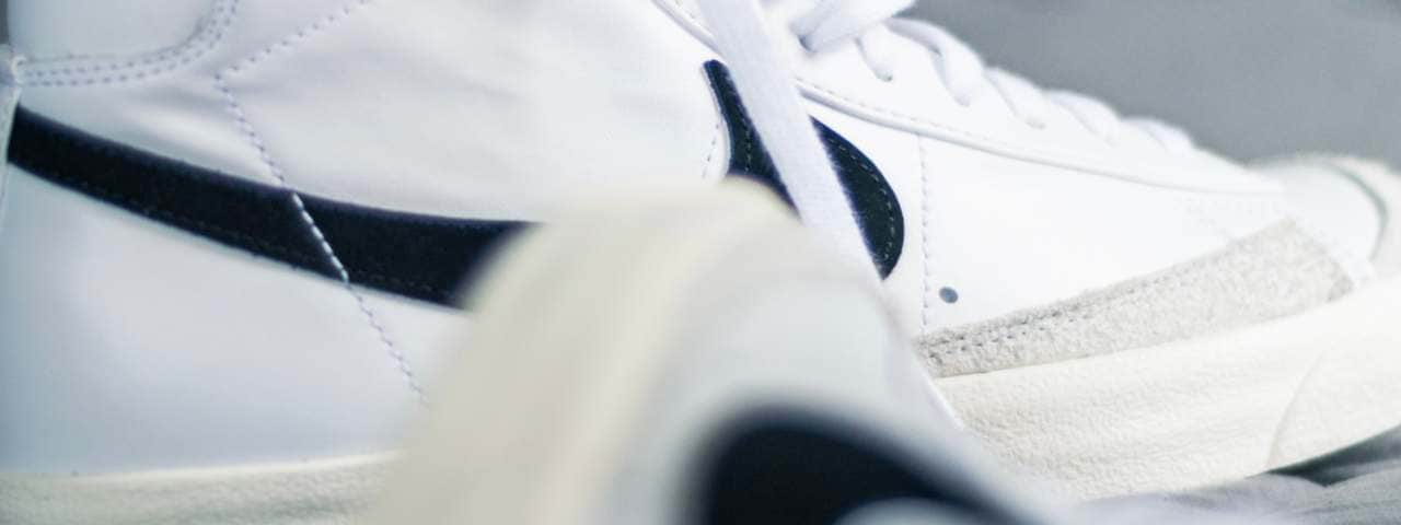 Closeup of white Nike trainers.