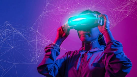 Young woman using VR simulator, background in neon colors.