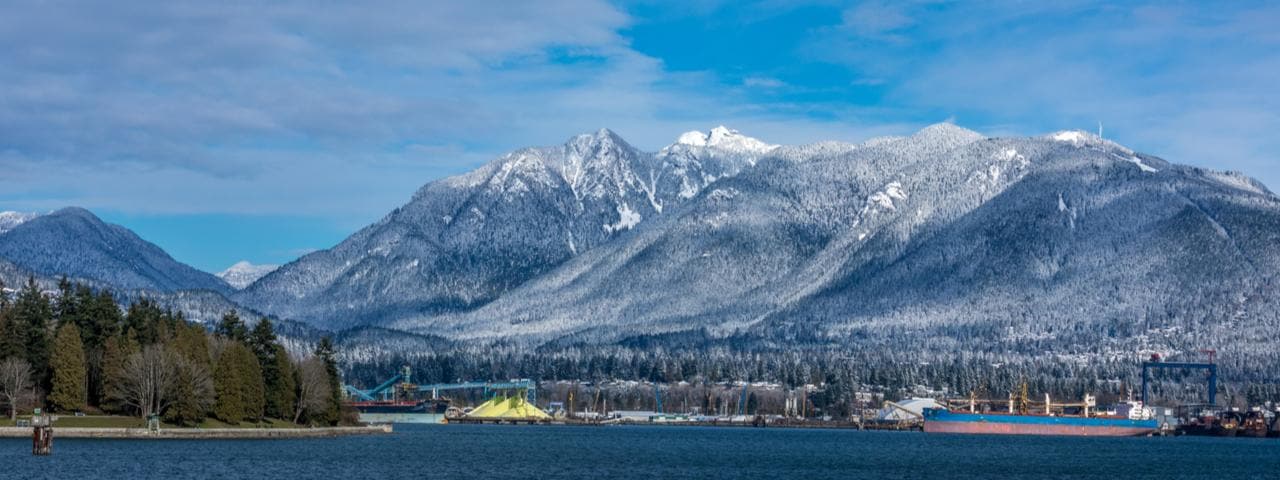 Tanker and the Rocky Mountains in Vancouver, British Columbia.