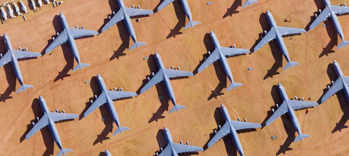 Retired aircraft parked at an airplane boneyard in the desert in Arizona, USA.
