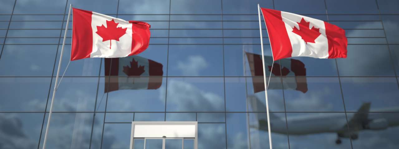 Canada flag in front of  the departure building
