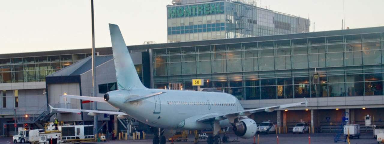 The commercial airplane in front of  Montréal–Pierre Elliott Trudeau International Airport