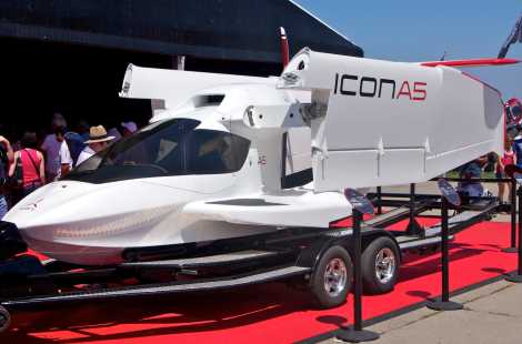 The ICON A5 on display on a red carpet at a trade show.