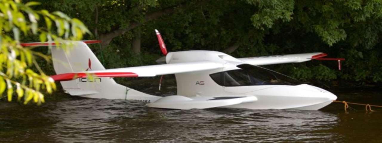 An Icon A5 rests in the water