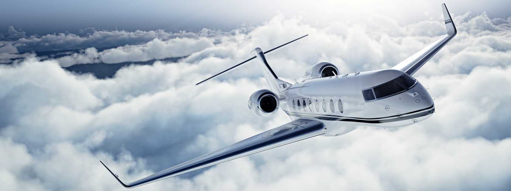 A private jet flying above the clouds