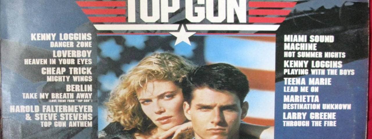 Old Top Gun Movie Poster with film stars Tom Cruise and Kelly McGillis in the centre