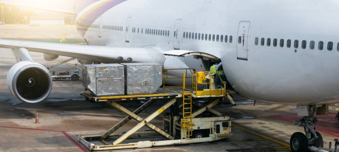 Cargo being loaded onto an airplane using forklift