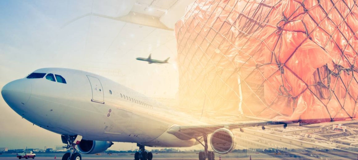 Double-exposure image of aircraft with cargo in foreground