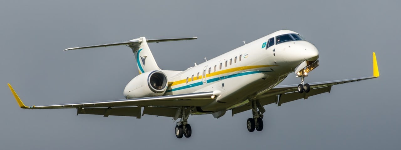 Embraer Legacy 650 landing in cloudy background