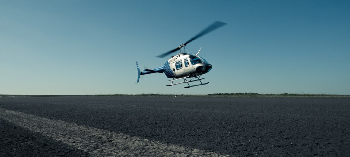 Bell 206 helicopter in flight.