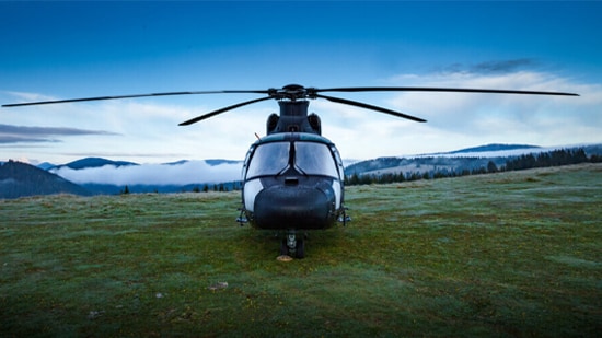 Helicopter with a mountain backdrop