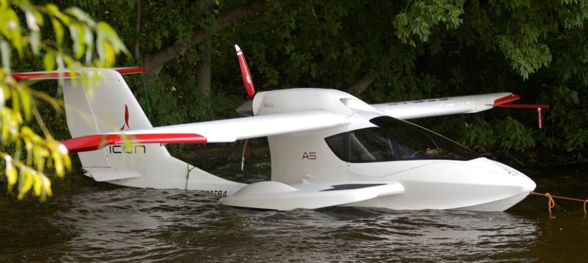 An Icon A5 rests in the water