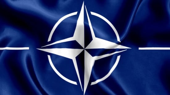 The white four-point NATO star on a blue background