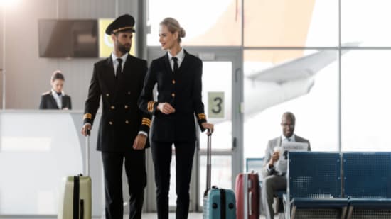 Male and Female pilot walking in the airport