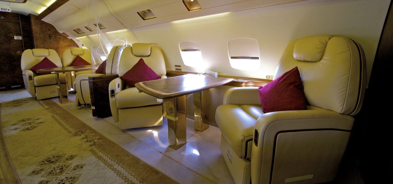 Beautiful interior of private business jet with cream leather seats