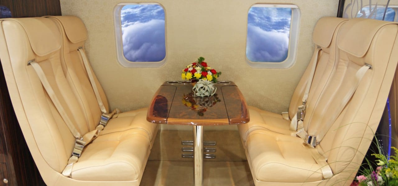 Cream leather interior of luxury salon inside private helicopter