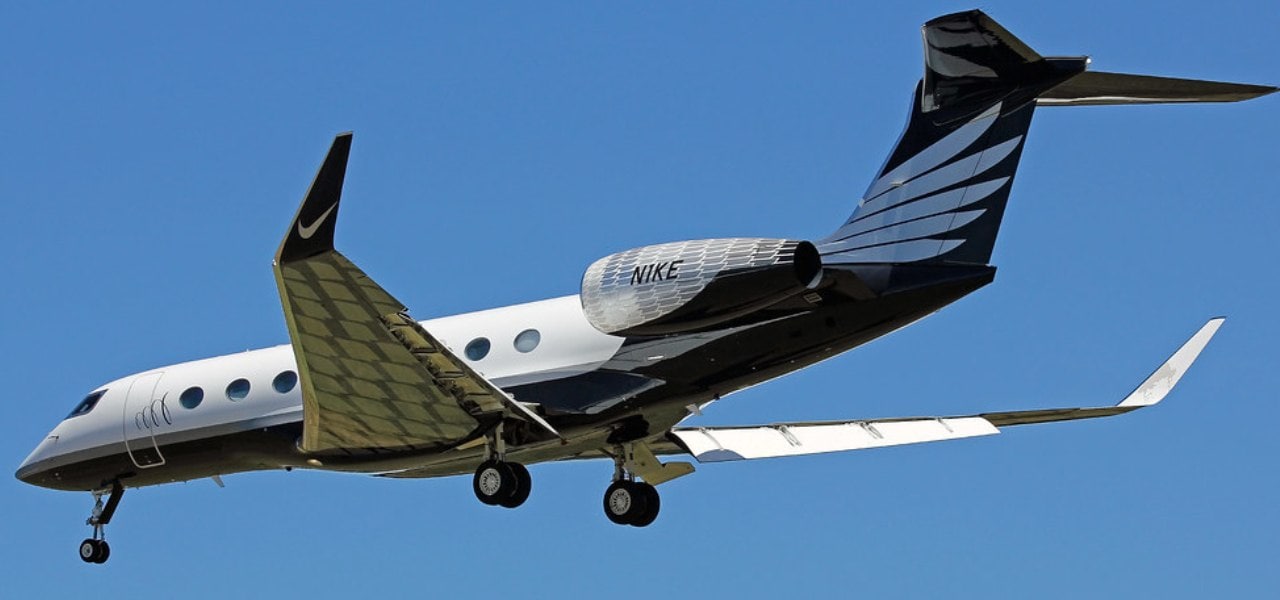 Nike feather branded Gulfstream G650 private jet in flight
