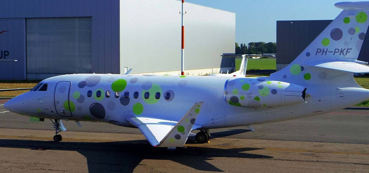 Peter Kutemann private jet branded with colorful bubbles