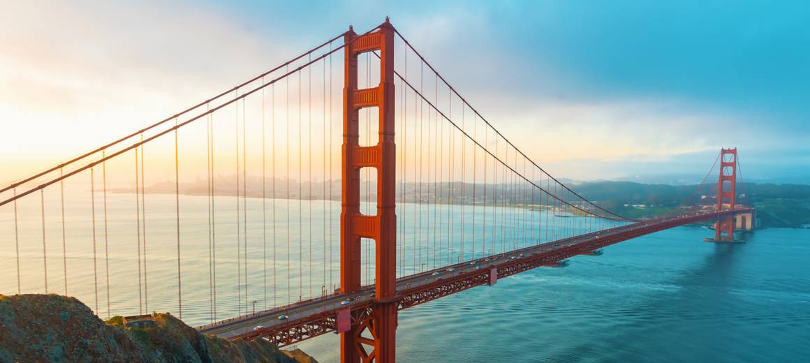 Golden Gate Bridge at sunset seen from San Francisco beach, California