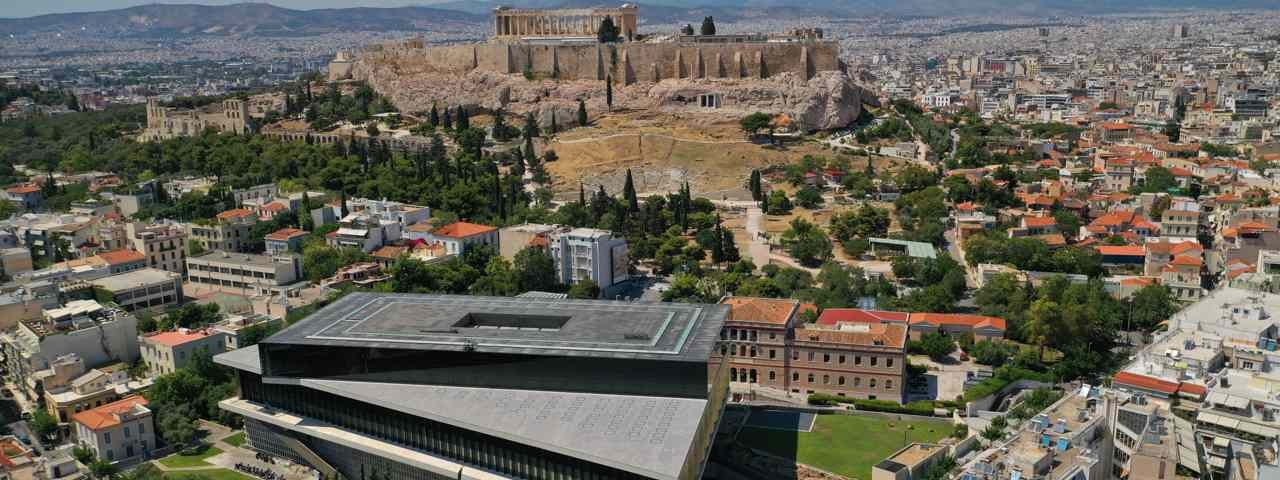 The Acropolis Museum in the foreground with the Acropolis itself in the background.