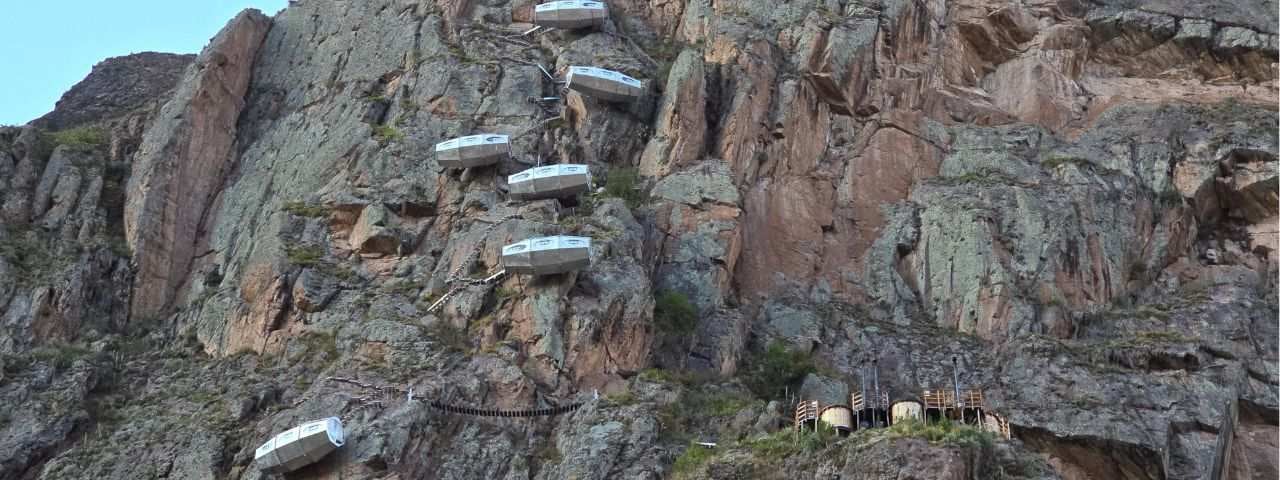Skylodge Adventure Suites - metal cliff pods in the Sacred Valley of Peru, that hang from the side of a cliff overlooking the Sacred Valley.