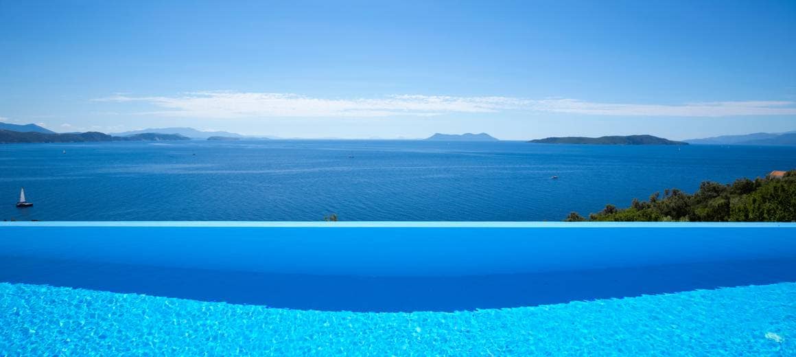 Infinity pool with the ocean view in the background