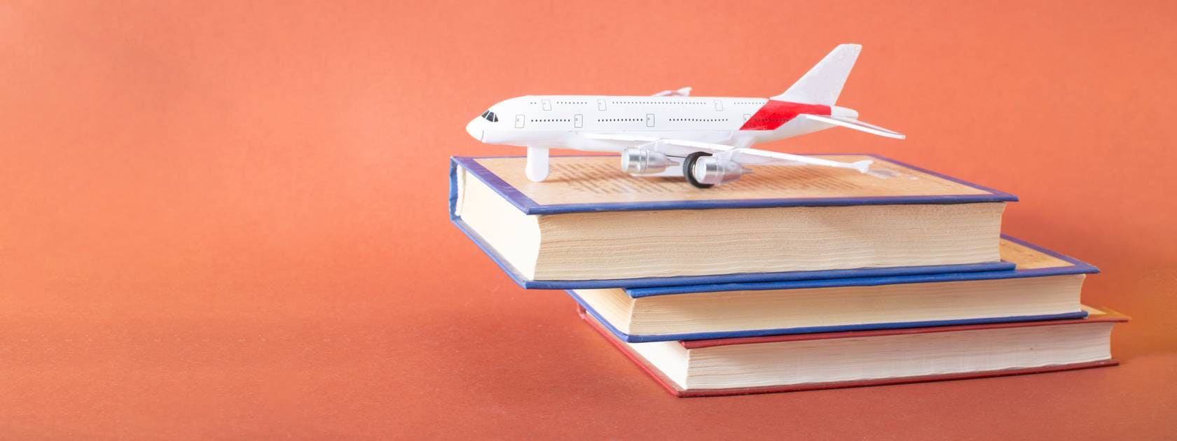 Plane on books.