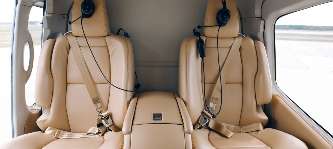 Black Eurocopter 120 Colibri with two beige leather seats