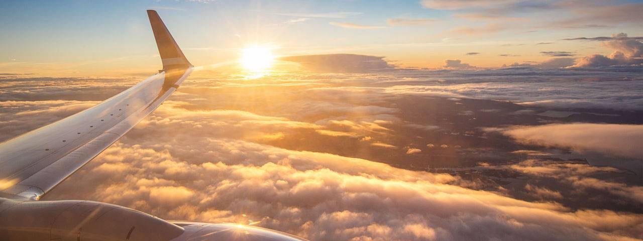 View from a plane of the wing of the sky at sunset.
