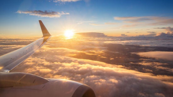 View from a plane of the wing of the sky at sunset.