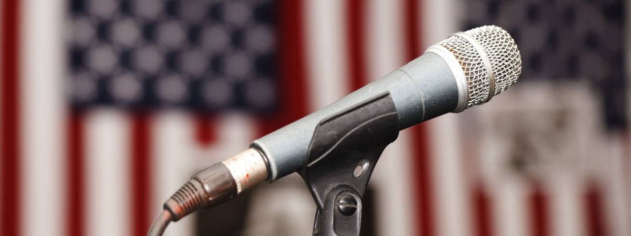 The microphone with the USA flag in the background.