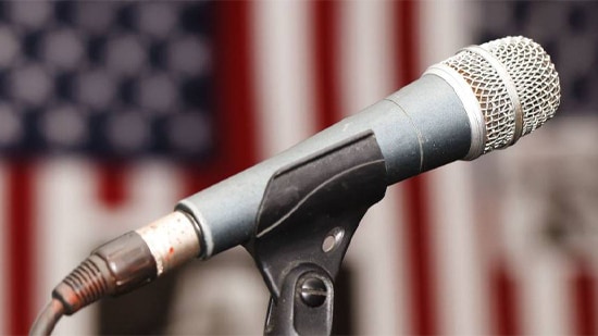 The microphone with the USA flag in the background.
