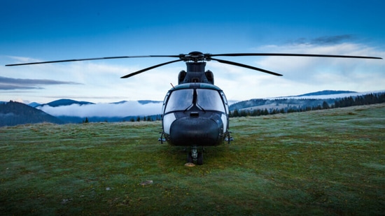 Helicopter with a mountain backdrop
