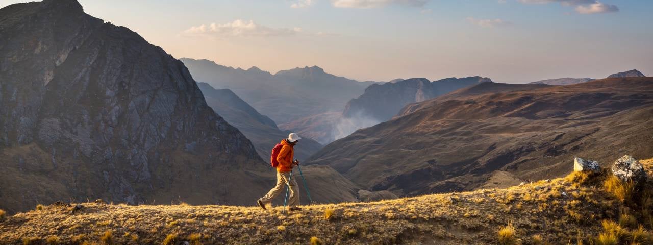A man hiking across the Cordillera mountains.
