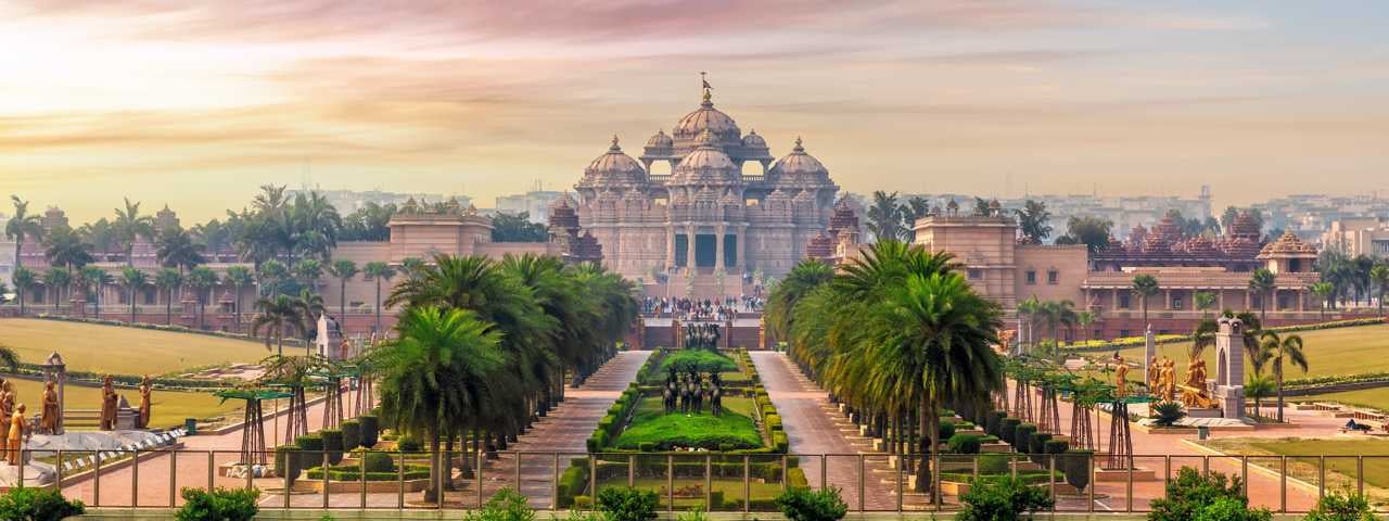Aerial view of the Swaminarayan Akshardham temple complex at sunset in Delhi, India.