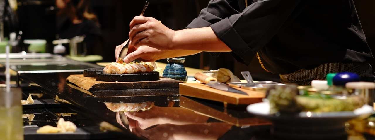 An aerial view of fall trees and the Atlanta city skyline.