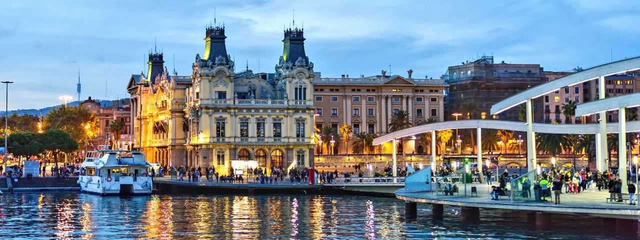 A photograph of Port Vell at sunset.