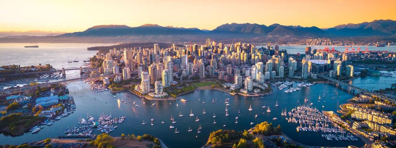An aerial view of Downtown Vancouver at sunrise.