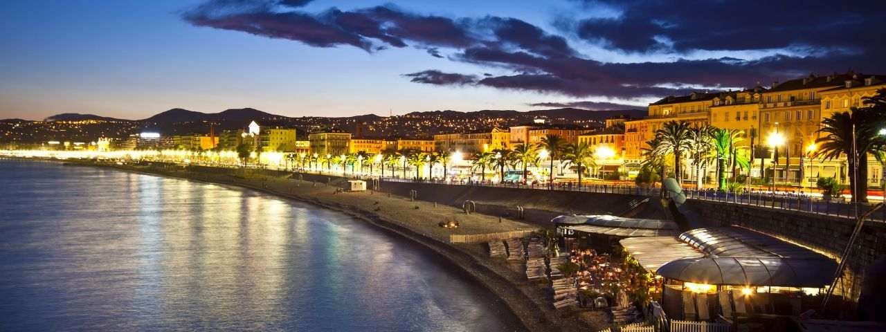 The beach and the waterfront of Nice, France, at night.