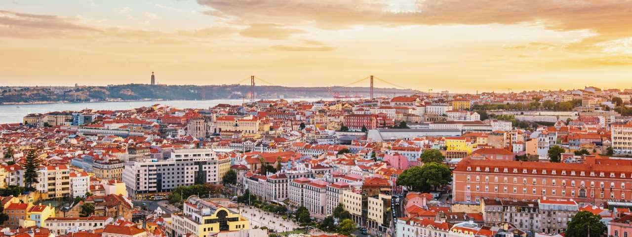 A panoramic view of Lisbon in sunset light.