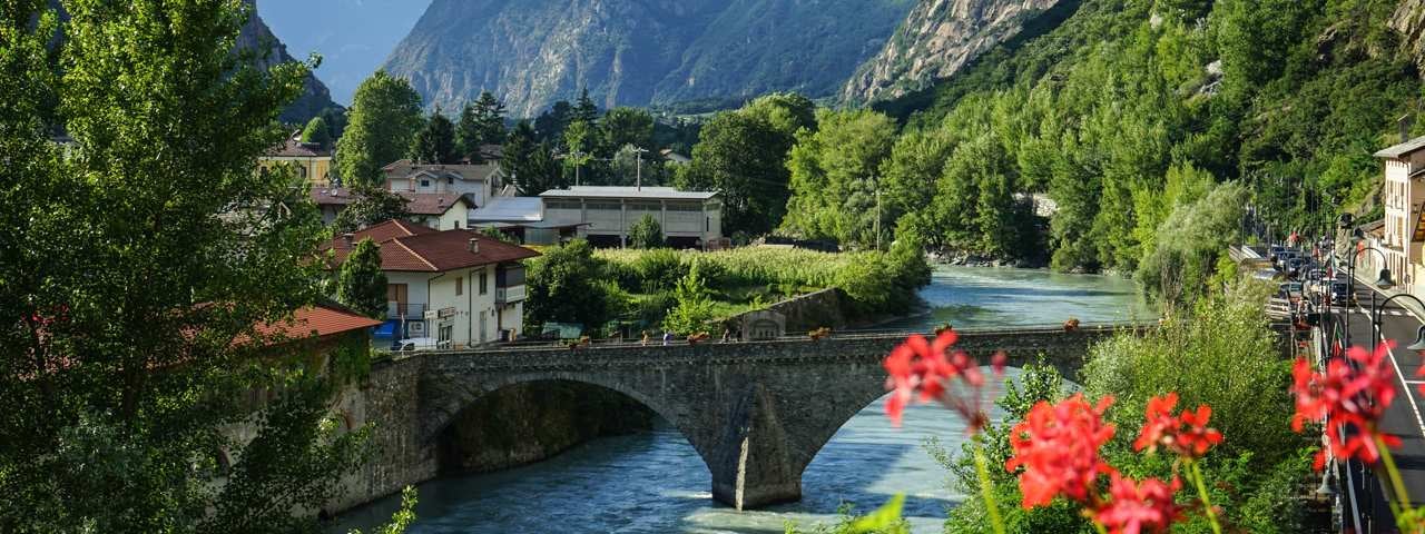 An aerial view of a village on the beach in Madeira with the ocean in the foreground.