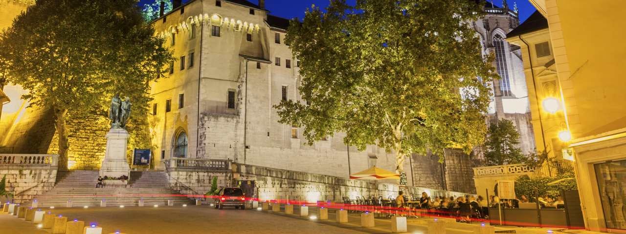 Customers dining at a restaurant outside the Castle of the Dukes of Savoie in Chambery, France.