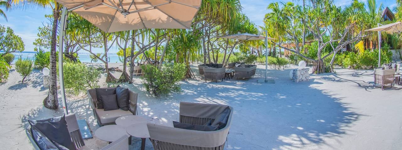 Shaded seating on the beach at The Brando.