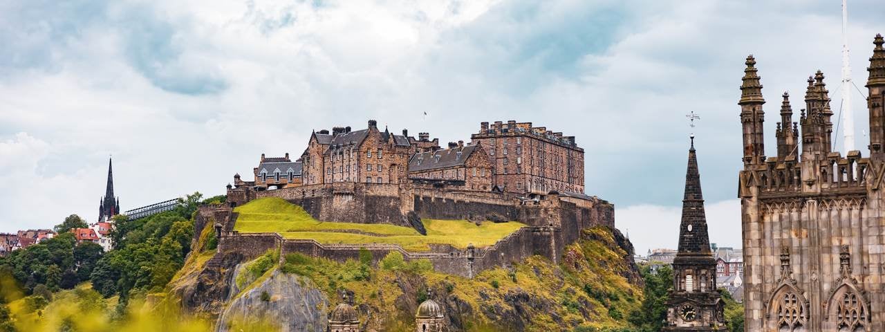 Edinburgh Castle on a hill overlooking the city. 