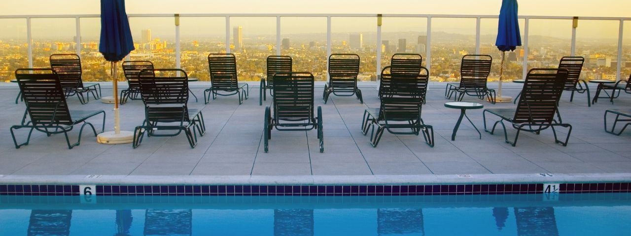A photograph of a rooftop pool overlooking the skyline in Hollywood, Los Angeles