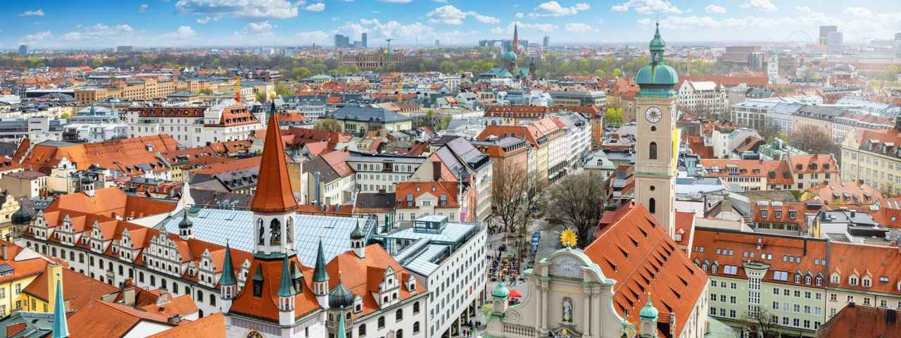 An aerial view of traditional buildings in Munich on a sunny day.